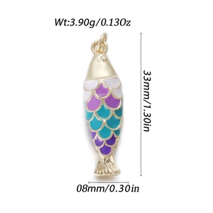 Close-up of 14k gold fish pendant with colorful enamel scales and dimension markings