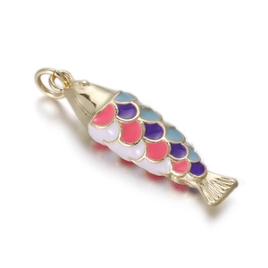 Macro shot of koi fish pendant with colorful enamel scales and golden metal frame