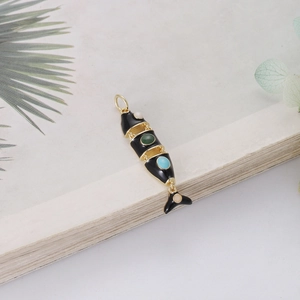 Articulated fish-shaped pendant in gold finish with black enamel and colorful gemstones