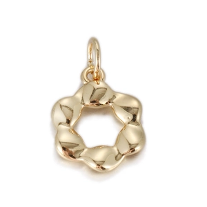 Detailed macro view of a 14k gold plated hollow flower charm pendant for DIY jewelry
