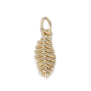 Detailed view of leaf-shaped copper pendant with 14k gold finish for jewelry DIY