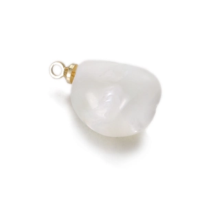 Macro detail of irregular baroque pearl pendant with gold metal bail for DIY jewelry making