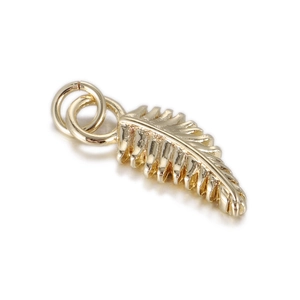 Detailed view of a golden feather pendant with intricate textures and metallic loops
