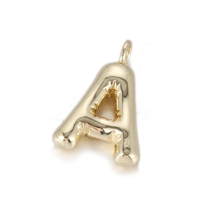 Close-up of golden bubble letter A pendant with smooth metallic finish and top loop