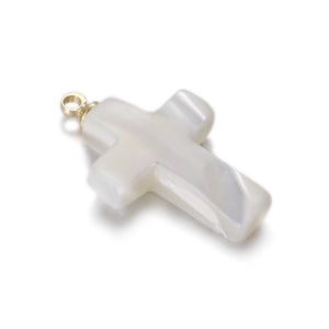 Detail of cross pendant made of white mother-of-pearl with a golden metal loop