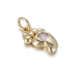 Detail of a 14k gold-plated baby foot pendant with a sparkling round zircon stone