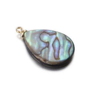 Macro shot of iridescent teardrop shell pendant with golden bail and natural shell luster