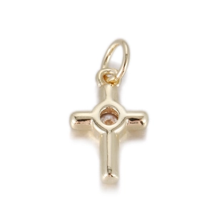 Close-up of 14K gold plated cross pendant with a brilliant cut center gemstone