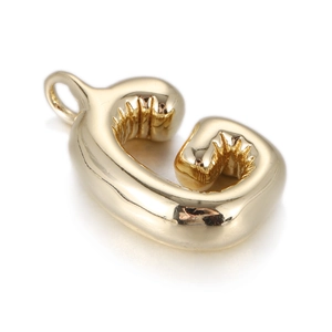 Detail of 3D balloon style letter G pendant in gold finish with mirror polished surface