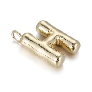 Macro shot of 3D gold balloon style letter H pendant with mirror polished finish