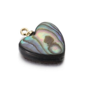 Macro shot of heart-shaped pendant featuring natural abalone shell with golden bail