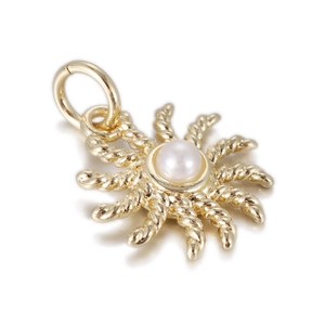 Detail view of Bohemian sun pendant with gold plating and a white pearl center