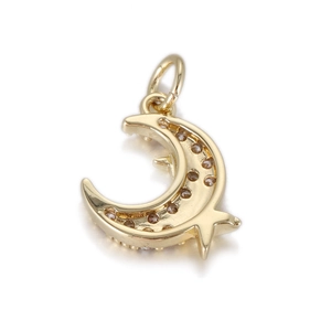 Detail of 14k gold plated moon and star pendant with brown zircon micro-inlay finish