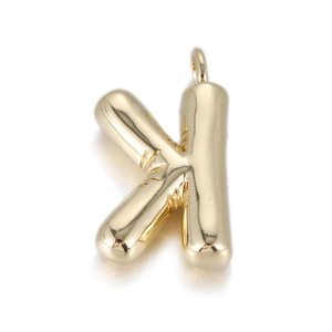 Detailed view of balloon-style letter K pendant in polished gold metal finish