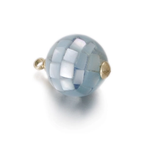 Macro detail of round light blue resin pendant with inlaid white shell pieces and gold loop