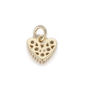 Macro detail of 14K gold plated heart charm with geometric hollow patterns and bail