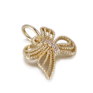 Detailed macro view of 14K gold plated butterfly pendant with beaded texture and zircons