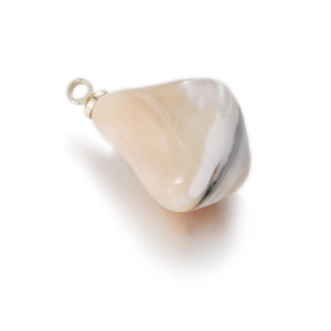 Macro detail of polished white shell stone pendant with elegant golden metal ring loop