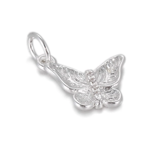 Macro view of a silver butterfly pendant with textured wings and small white gems