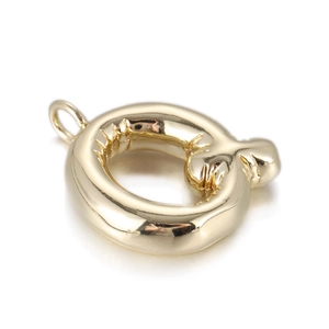 Detailed view of a gold round pendant with a unique pleated texture and top ring loop