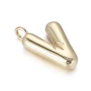 Detailed close-up of a polished gold letter V pendant with a sleek metallic mirror finish
