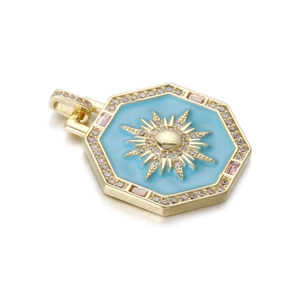 Detailed macro of gold sunburst tarot pendant with blue enamel and pavé crystals