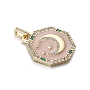Detailed macro view of an octagonal tarot pendant with pink enamel and gold star moon patterns