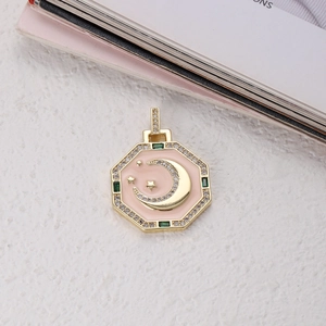 Detailed macro view of an octagonal tarot pendant with pink enamel and star moon motif
