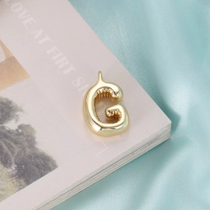 Modern 3D puffy golden letter G pendant necklace with polished balloon design aesthetic