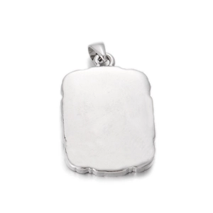Macro shot of silver rectangular pendant with wavy embossed edge and polished surface