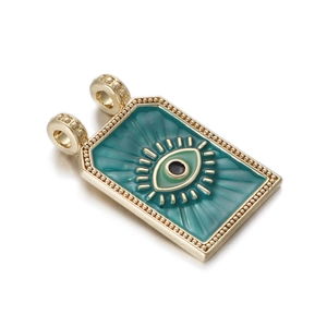 Detail of tarot evil eye pendant with teal enamel and beaded gold-plated edges