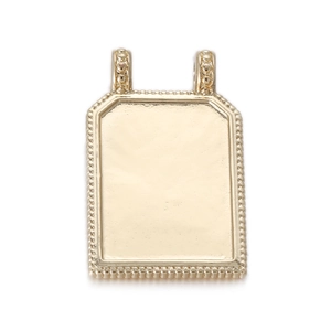 Macro detail of golden 14K tarot pendant with beaded edges and double loops for jewelry DIY