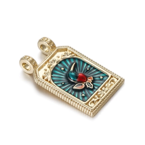 Close-up of golden tarot pendant with colorful enamel flower and double hanging loops