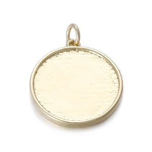 Detail of round gold pendant with frosted texture and top jump ring for DIY jewelry