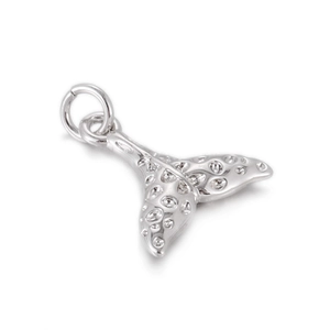 Detailed view of a silver whale tail pendant with textured finish and jump ring attachment