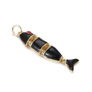 Detailed view of articulated fish pendant with black enamel and gold accents for DIY jewelry