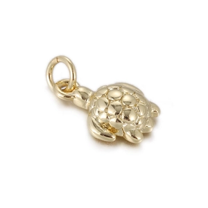 Detailed view of 3D turtle charm in gold finish with engraved shell pattern for DIY jewelry