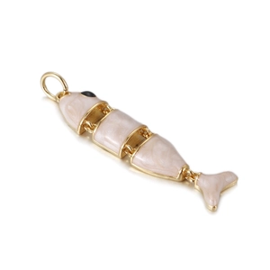 Detailed macro view of a flexible golden fish charm with articulated body and cream enamel
