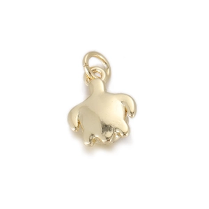 Close-up of polished gold turtle charm pendant with dual ring clasp for jewelry making