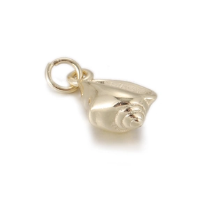 Macro detail of a golden conch shell pendant for DIY jewelry making accessories
