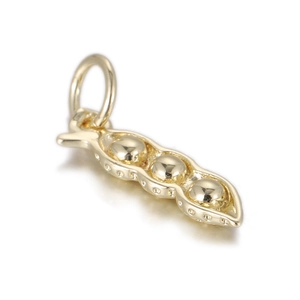 Detailed view of a polished gold pea pod pendant with three peas on a white background