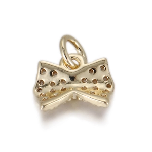 Detail of a gold plated bow pendant connector with delicate hollowed out pattern