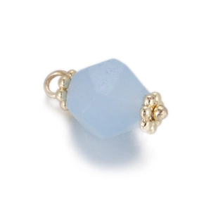 Detailed macro view of light blue geometric faceted natural stone pendant with gold caps
