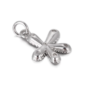 Macro detail of star-shaped silver pendant with clear cubic zirconia stones and top loop