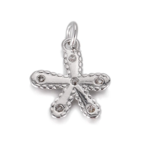 Detailed macro view of a silver five-petal flower pendant with white crystals and bead edges