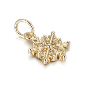 Detailed close-up of a 14k gold plated snowflake pendant with sparkling zircon stones