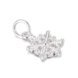 Detailed view of silver snowflake pendant with micro zircon stones and metal ring hook