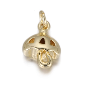 Macro shot of gold umbrella charm with hollowed canopy and curved handle detail