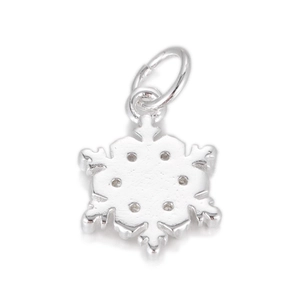 Detailed view of a silver snowflake pendant with a polished six-point geometric design