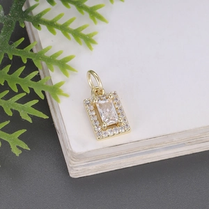 Gold rectangular emerald cut zircon pendant with sparkling pavé crystal halo accent